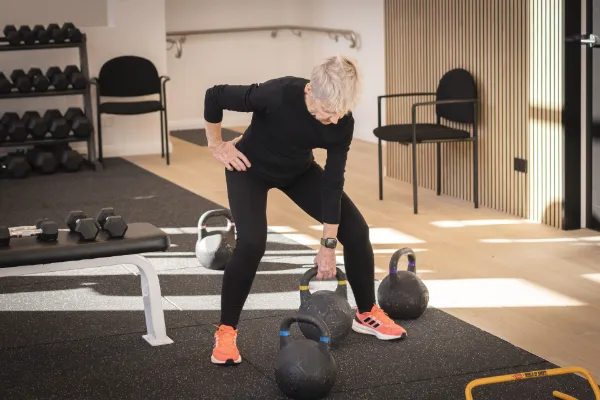 Move Clinic Physiotherapy Exercise Physiology Senior Woman Training with Kettlebells